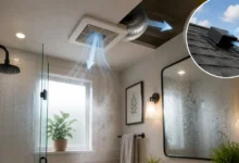 Modern bathroom with an exhaust fan removing humid air through ductwork to an outdoor roof vent, with a steamy glass shower and fogged mirror.